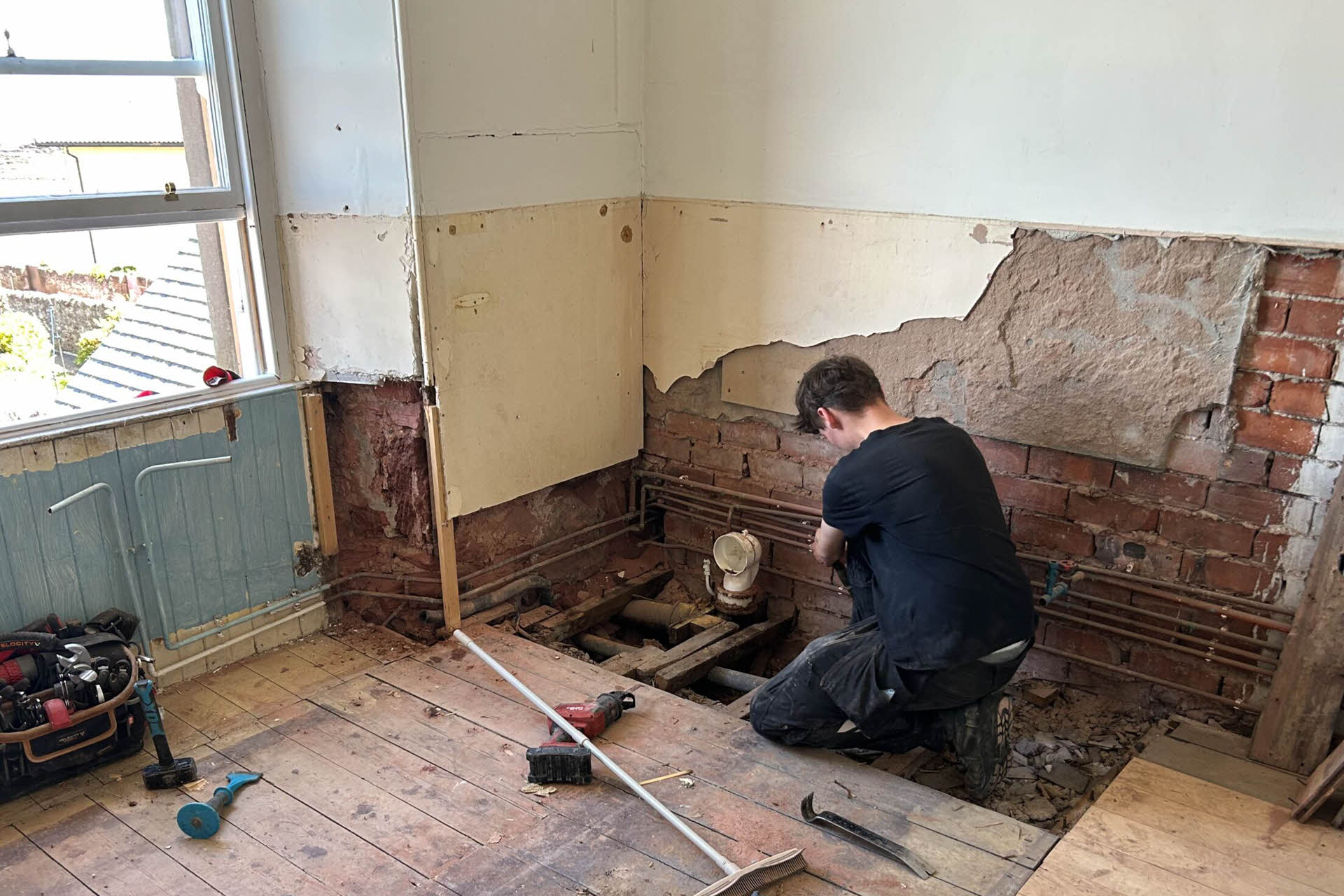 Working on the plumbing and drainage in this Edinburgh bathroom.